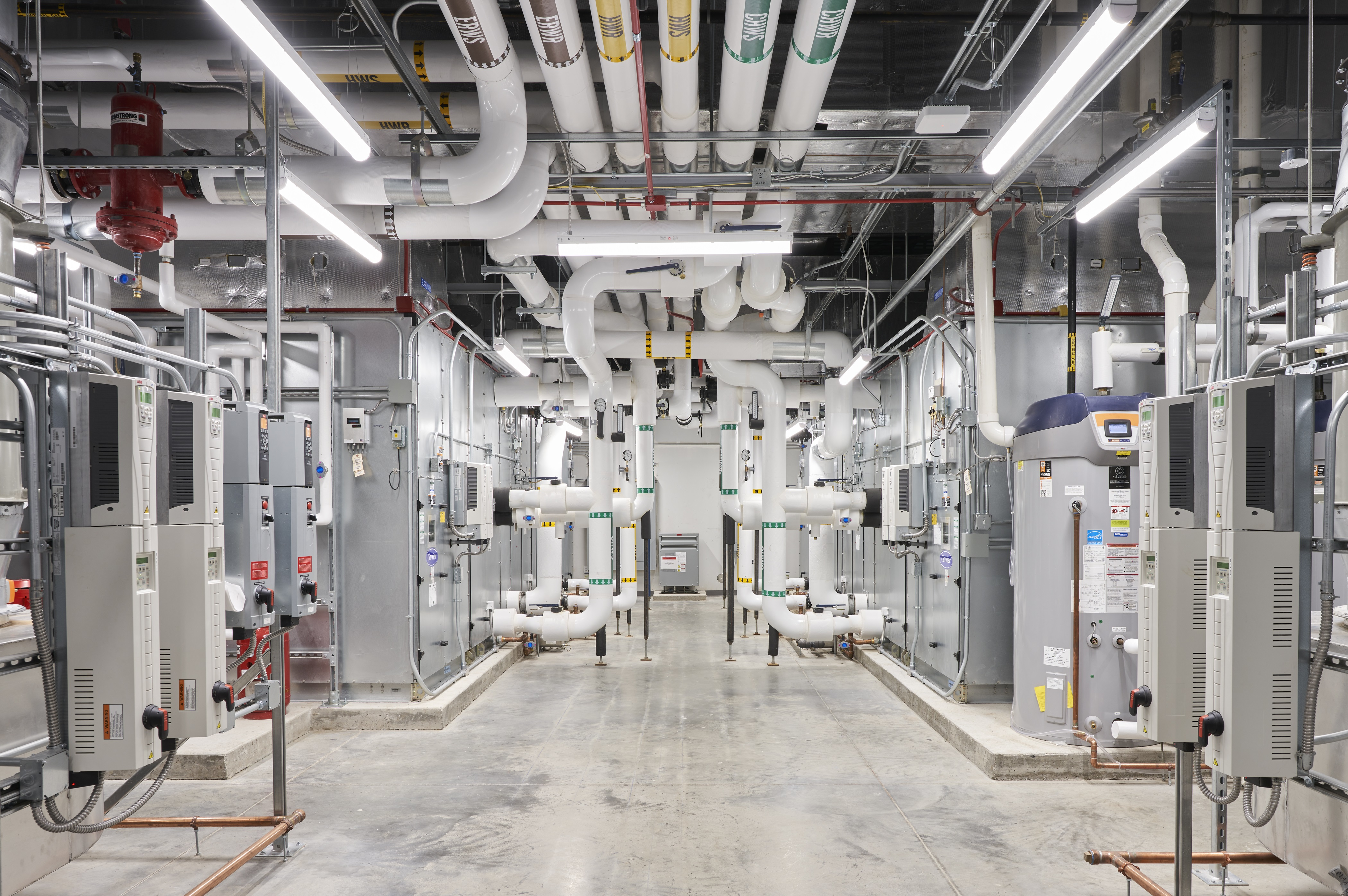 Commercial mechanical room with equipment and piping