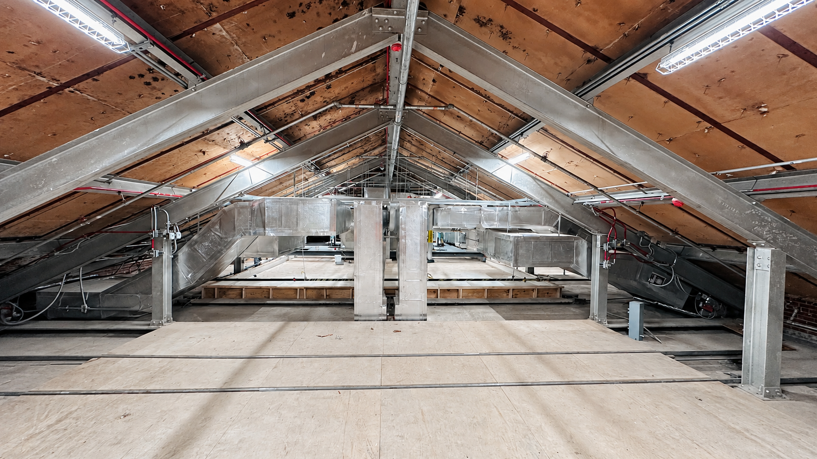 Commercial ductwork installation in an attic mechanical space